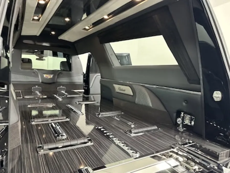 Luxurious interior of a high-end vehicle with sleek black finishes and modern design elements.