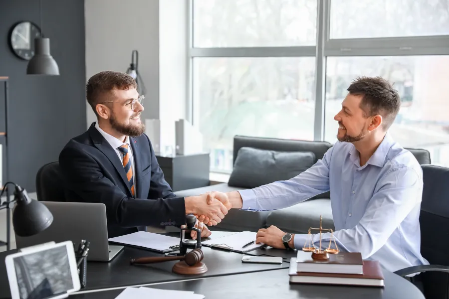 men sitting at a table talking