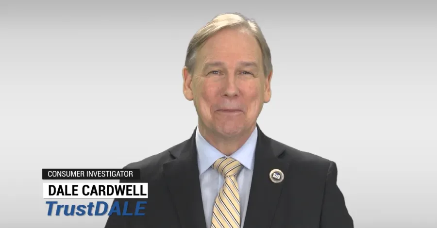 Consumer investigator Dale Cardwell in suit and tie with TrustDALE branding on light gray background.