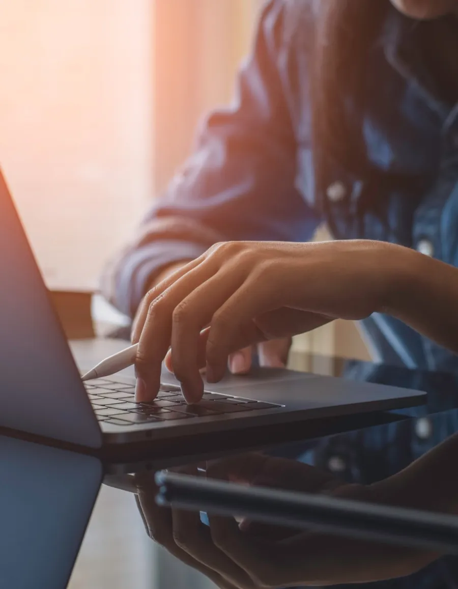 a person typing on a laptop