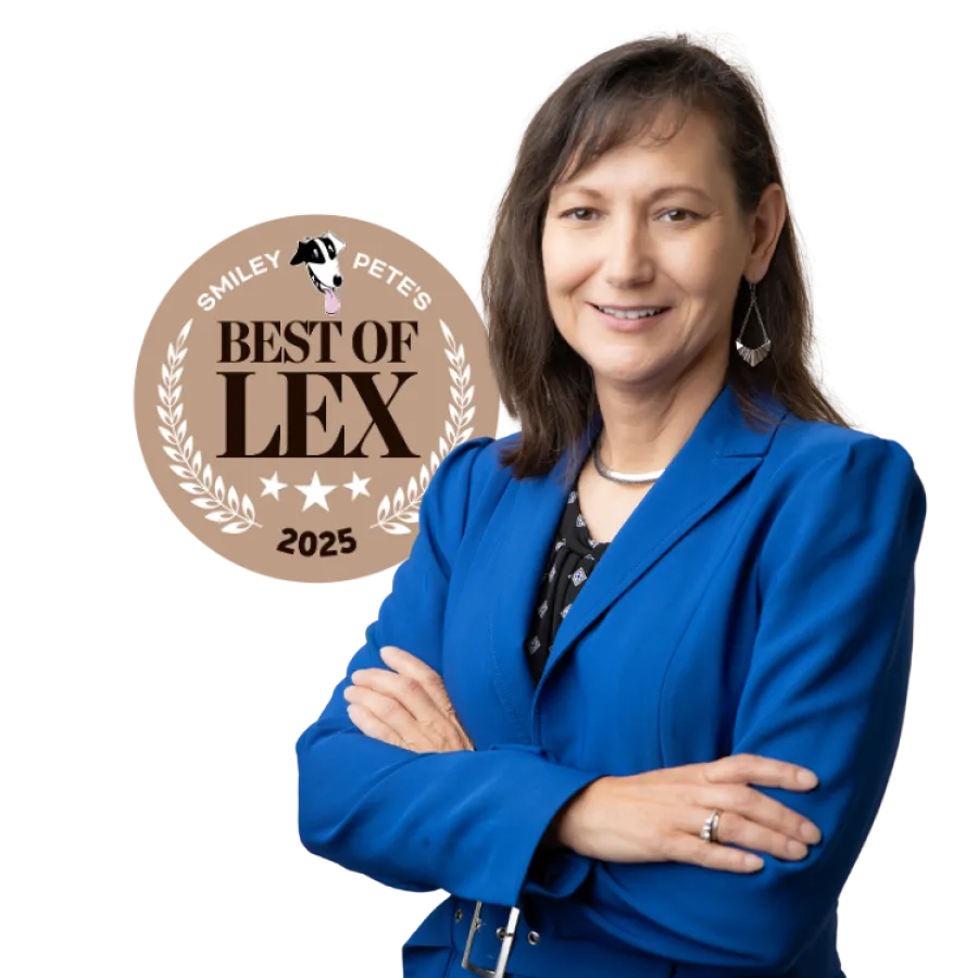 Professional woman in blue blazer smiling with arms crossed next to Best of Lex 2025 award badge