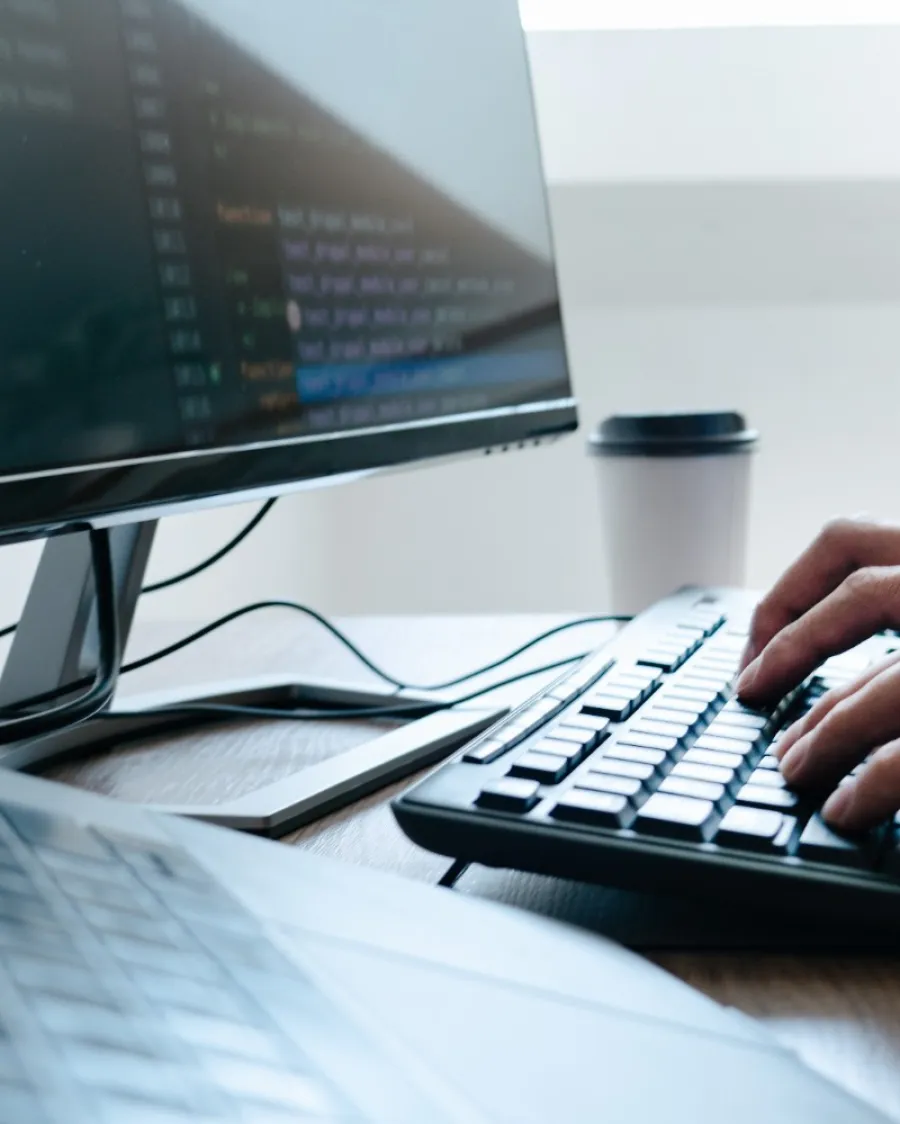 a person typing on a keyboard