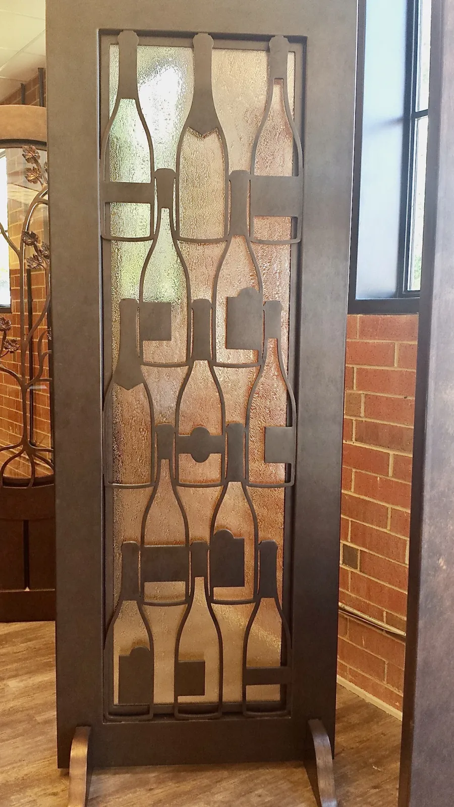Custom Iron door showing wine bottles