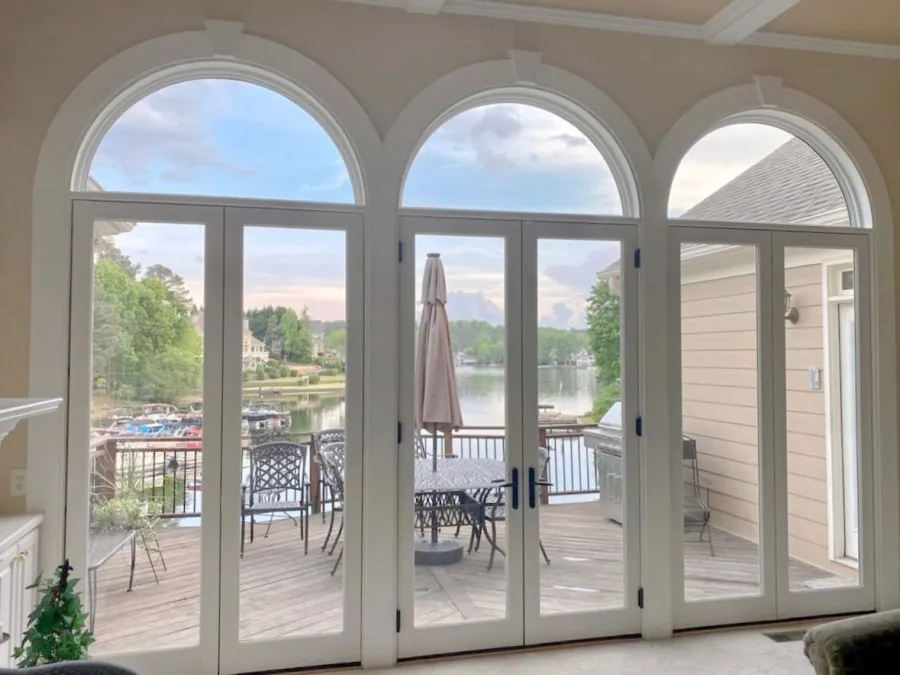 a room with a patio and a table and chairs