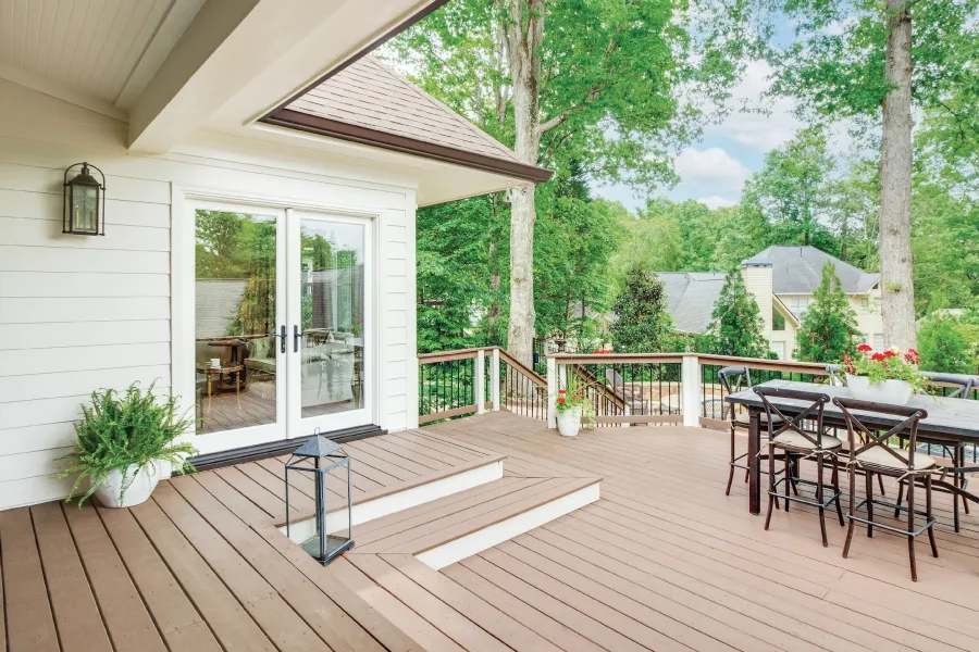 a deck with chairs and tables on it