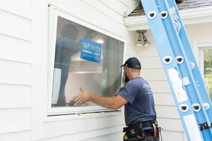 a police officer pointing at a window
