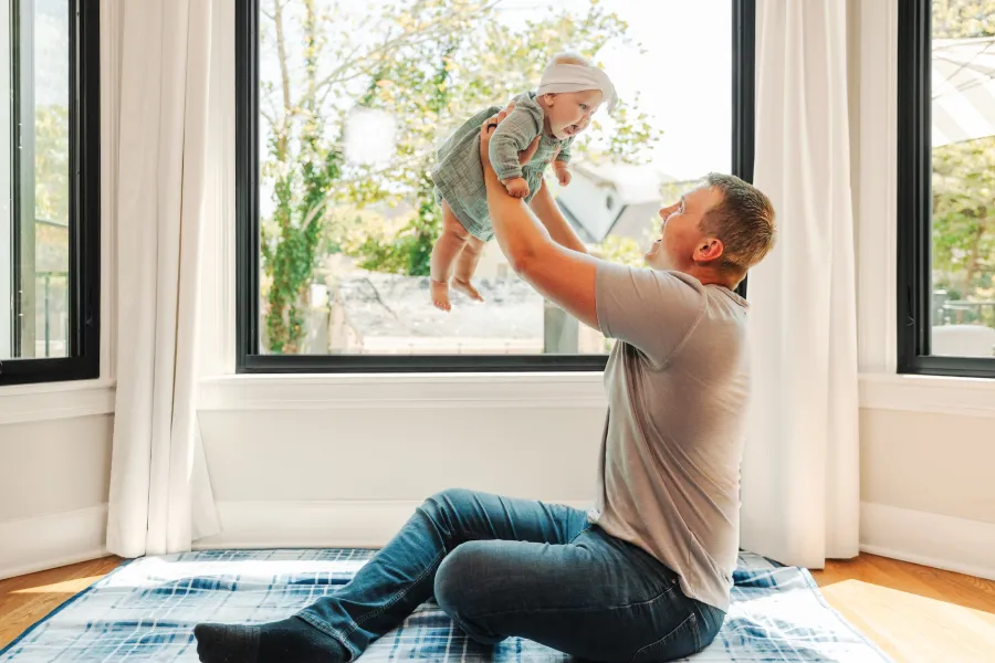 a person holding a baby