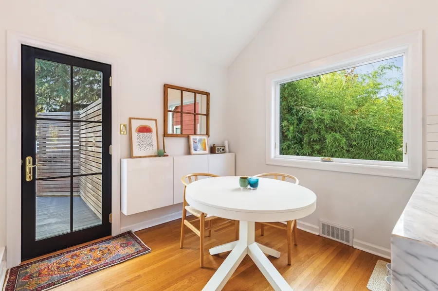 A kitchen with energy efficient awning windows and fiberglass door