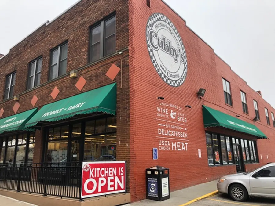 a brick building with a sign on it