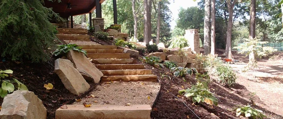 a stone staircase in a park