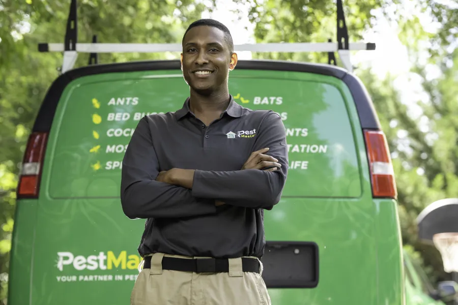 a man standing in front of a green van