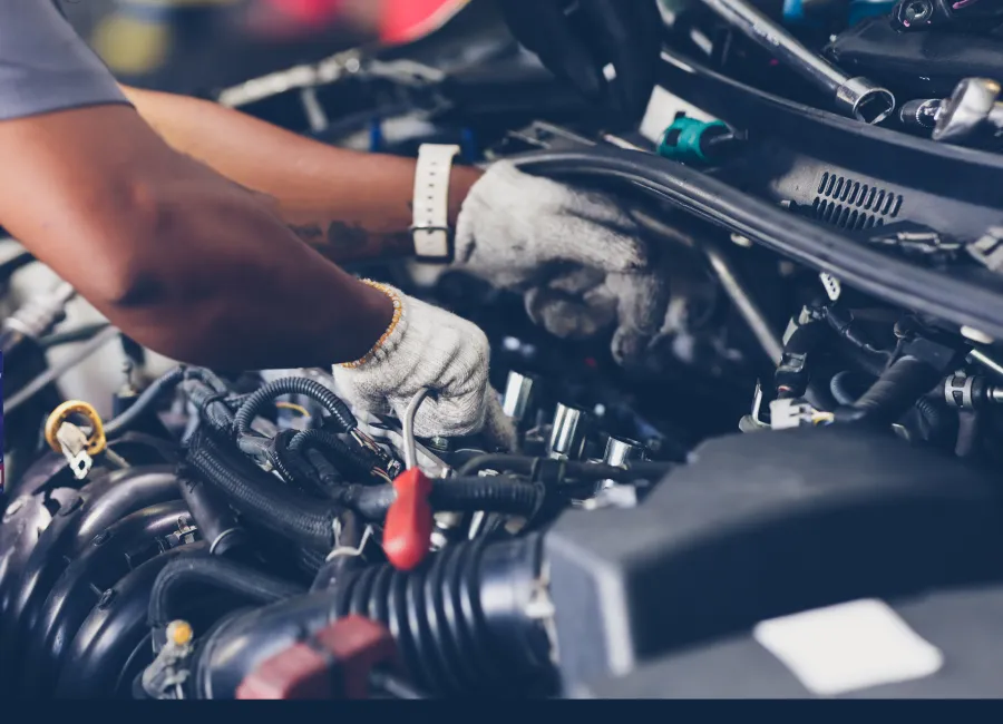 a person working on a car engine