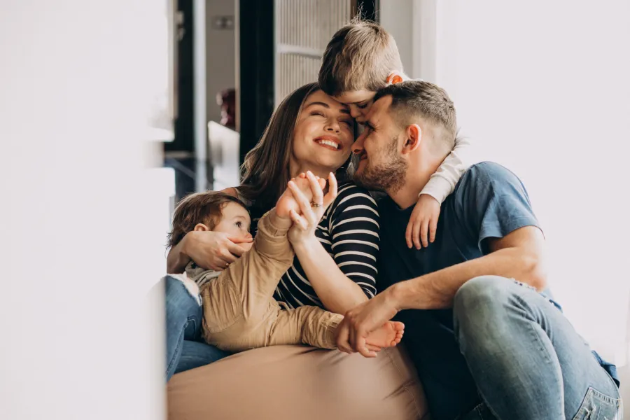 a family sitting on a couch