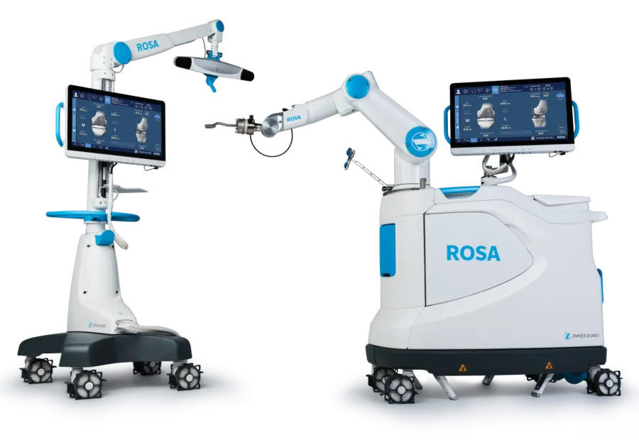 ROSA robotic surgical system with dual arms and touchscreens for precision medical procedures on white background.