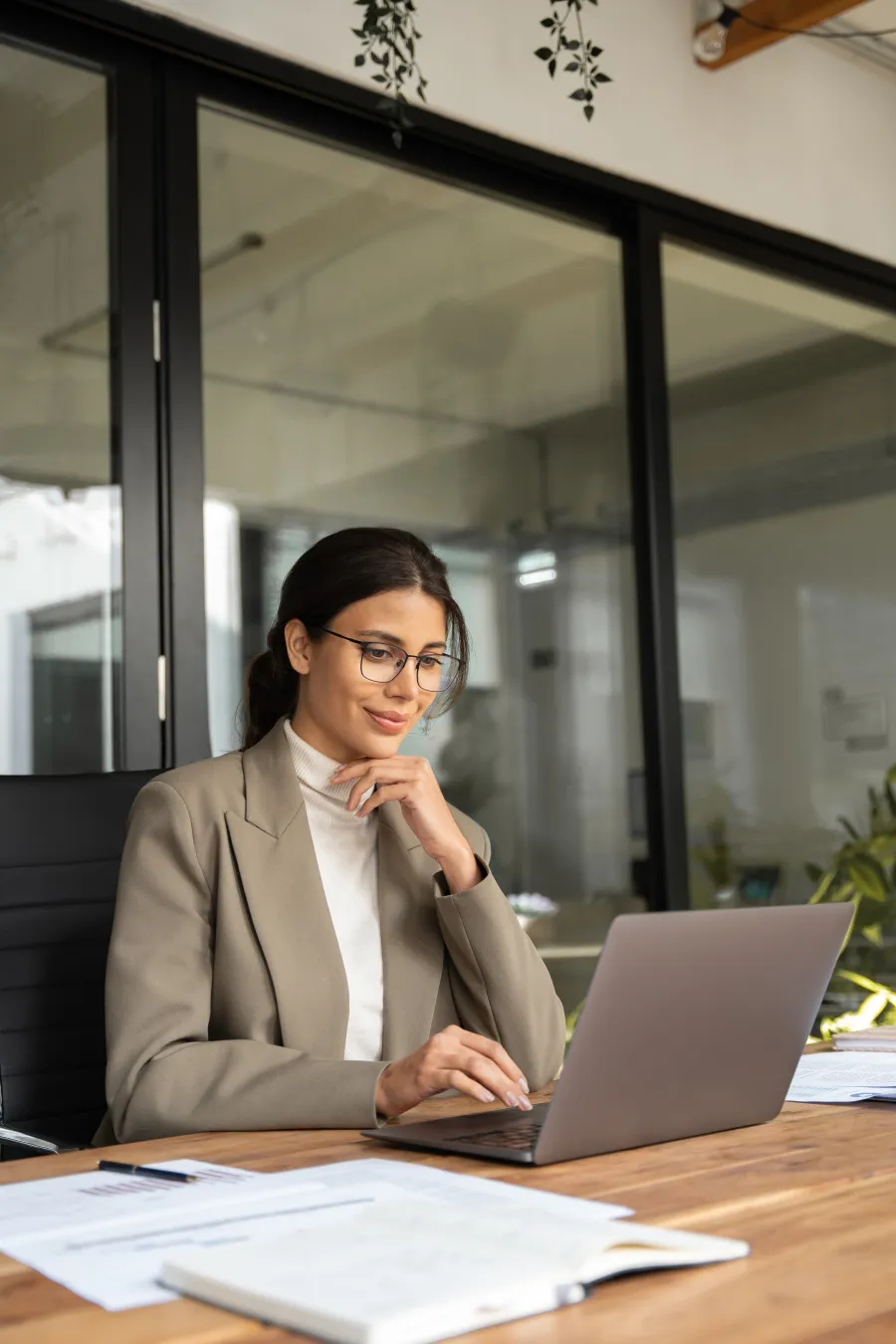 a man and a woman looking at a laptop
