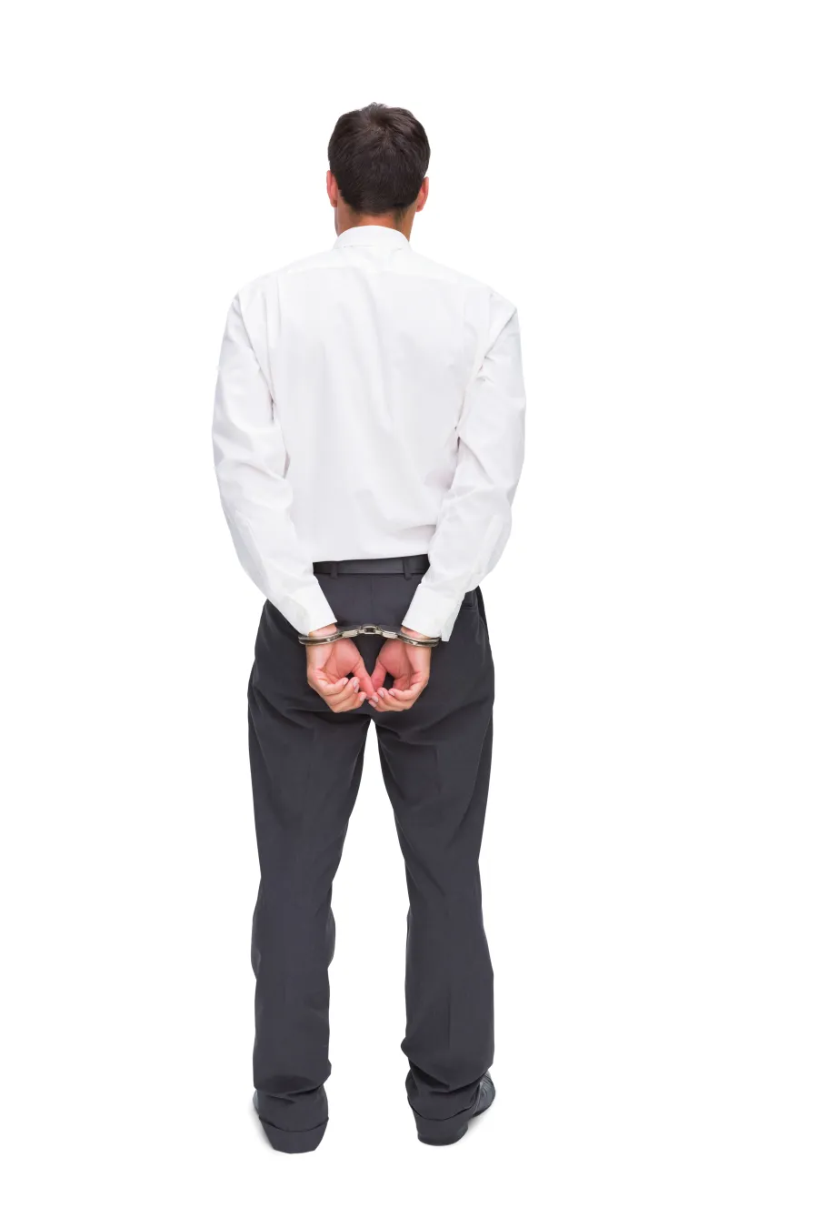 a person wearing a white shirt and black pants with handcuffs on