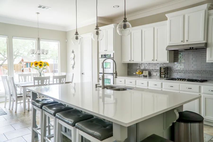 a kitchen with white cabinets