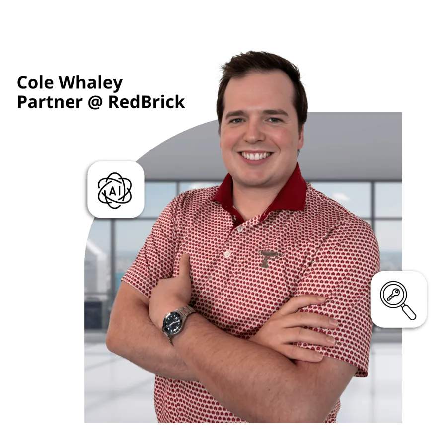 Smiling man in patterned red shirt standing with arms crossed in modern office with AI and key icons