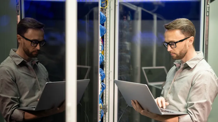 men looking at a laptop