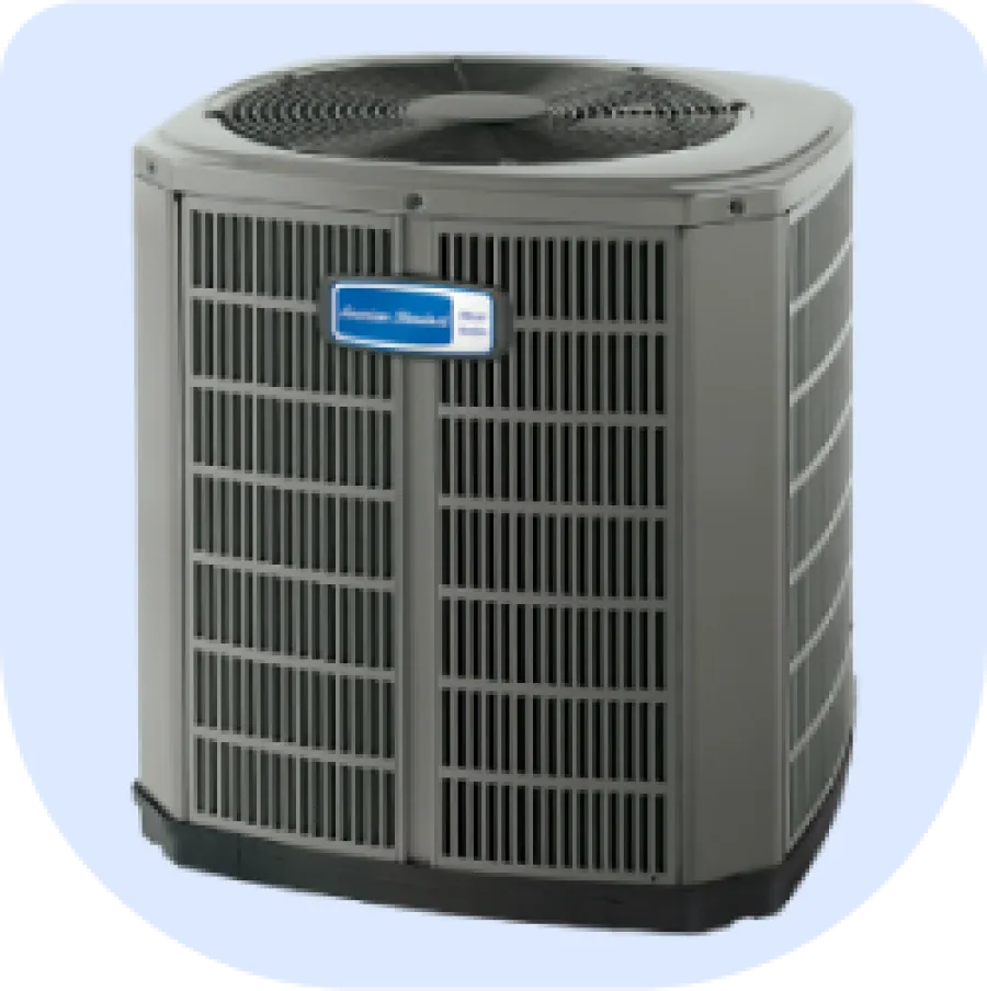 American Standard outdoor air conditioning unit with ventilation grills and top fan for home cooling.