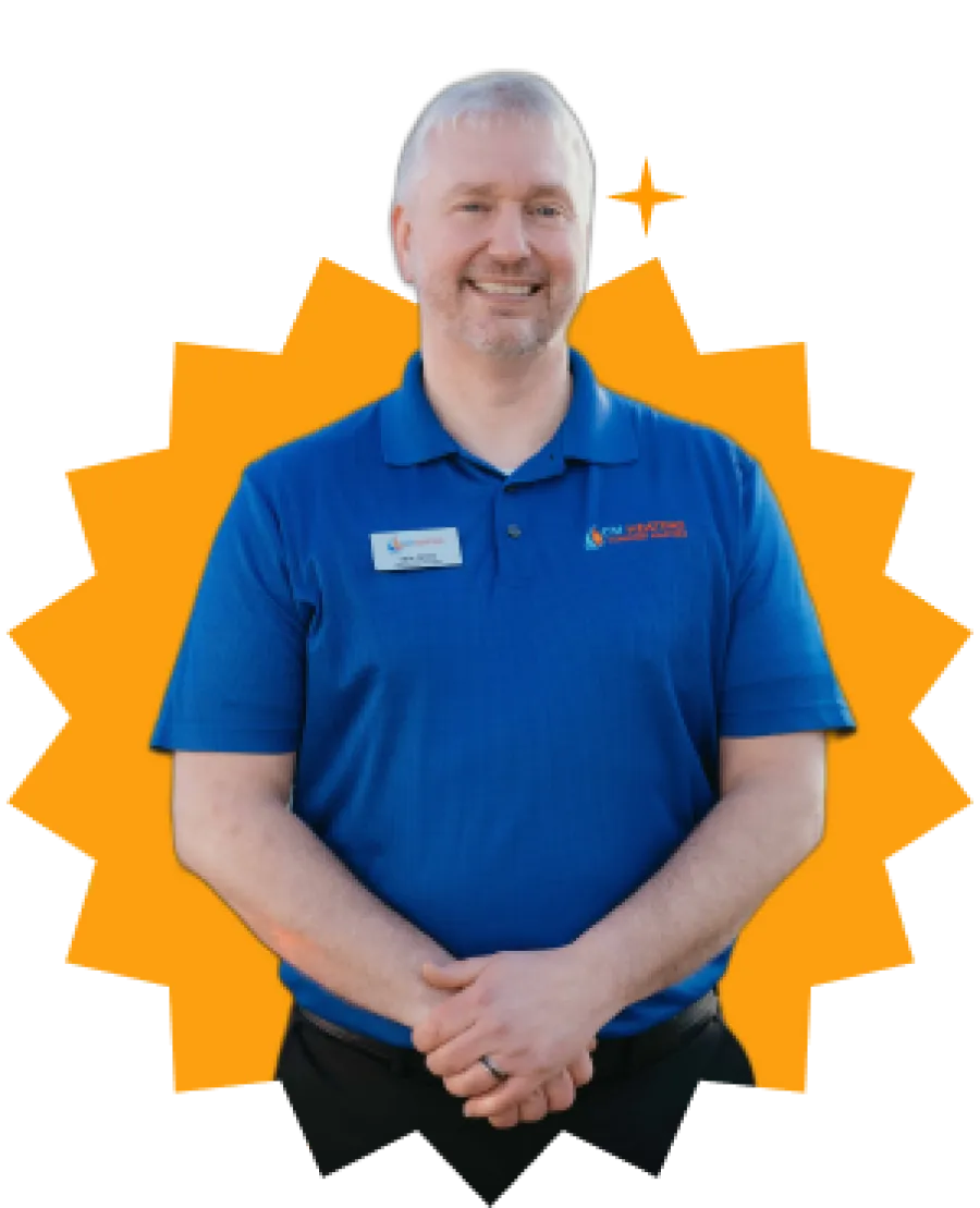 Smiling man in blue polo shirt with nametag standing against orange starburst background.