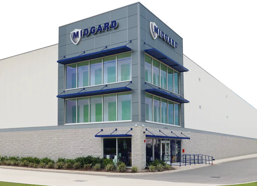 Modern Midgard company building with large glass windows and bold signage on a clear day.