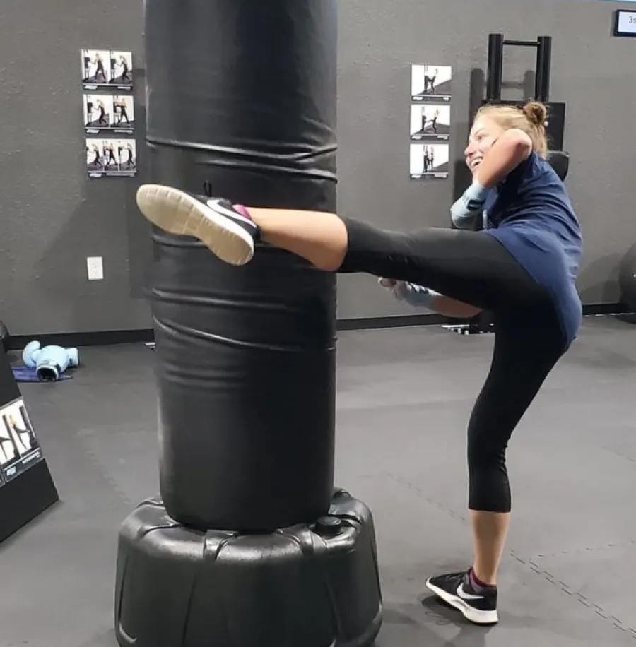 a person doing a back bend on a weight bar