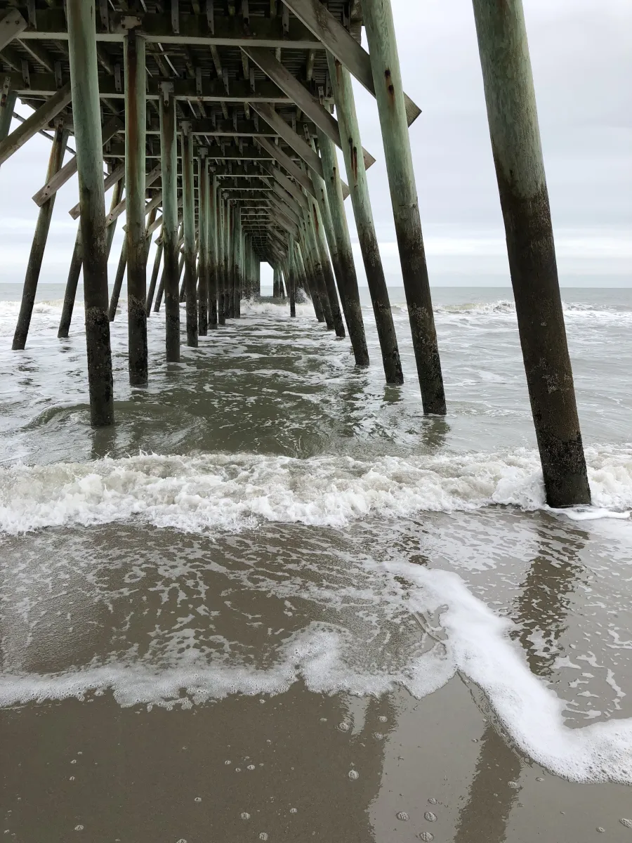 a wooden pier over the ocean