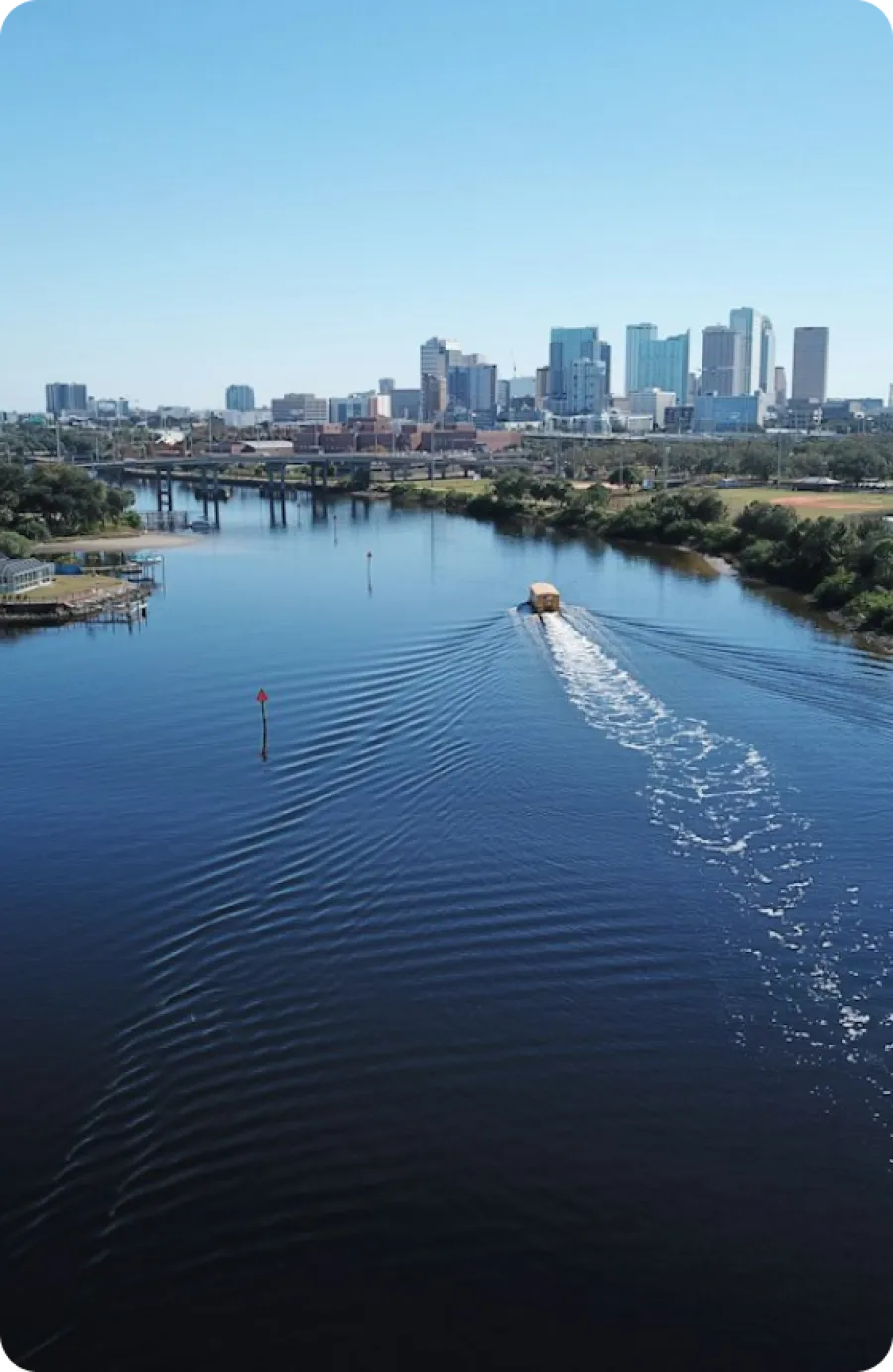 a body of water with a city in the background