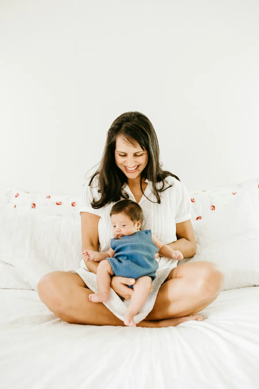 a woman holding a baby
