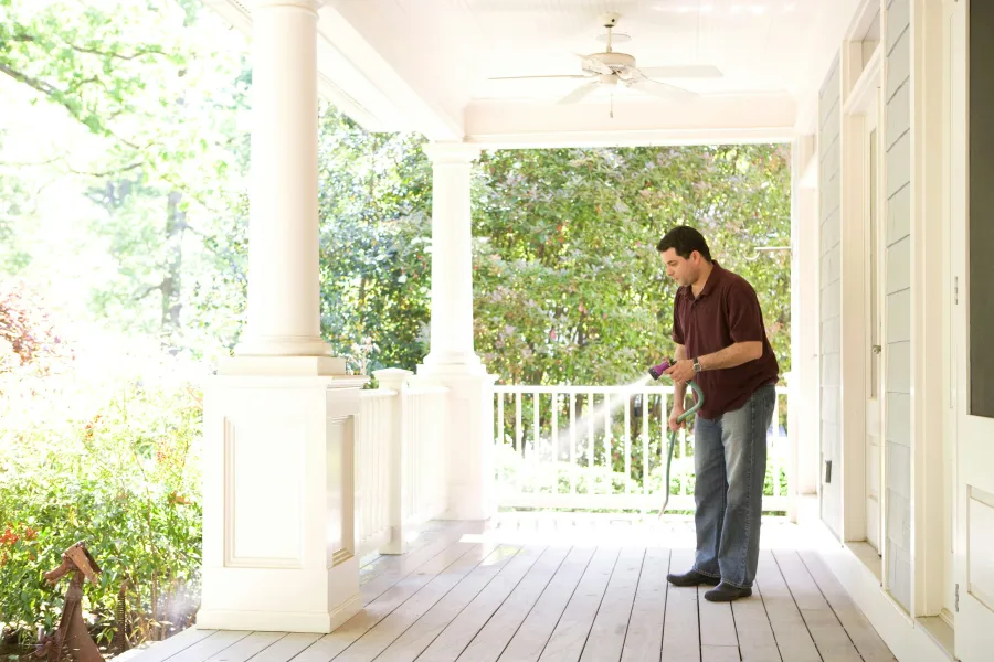 a man standing on a porch