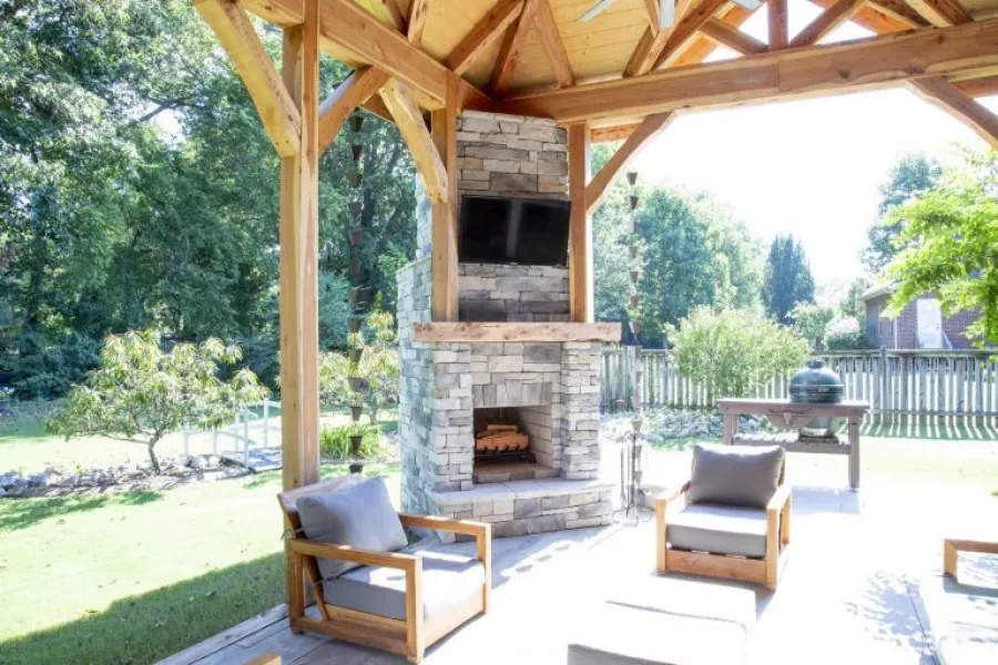 a fireplace in a backyard