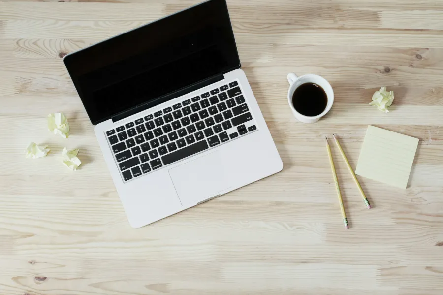 a laptop and a cup of coffee