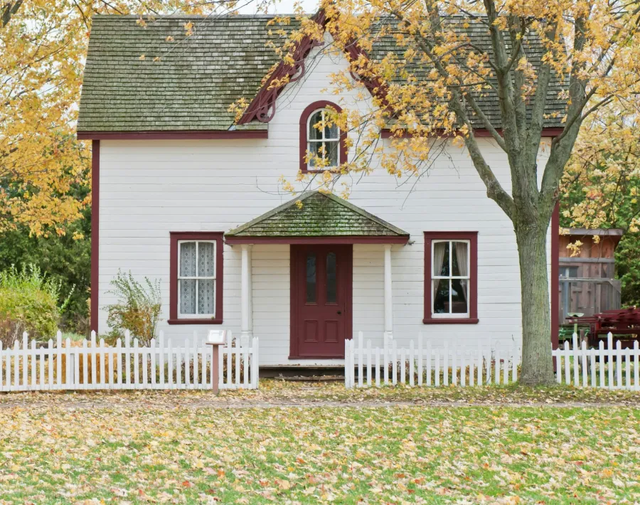 a white house with a red door