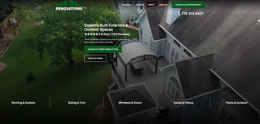 Aerial view of a renovated outdoor deck with pergola next to a large house surrounded by trees and lawn.