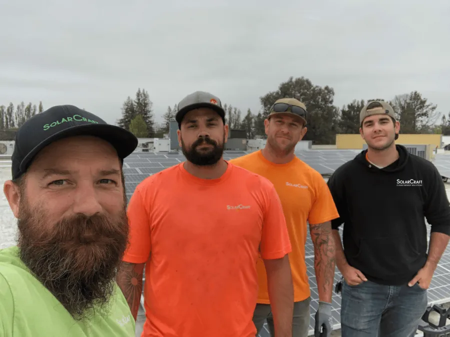 a group of men posing for a photo