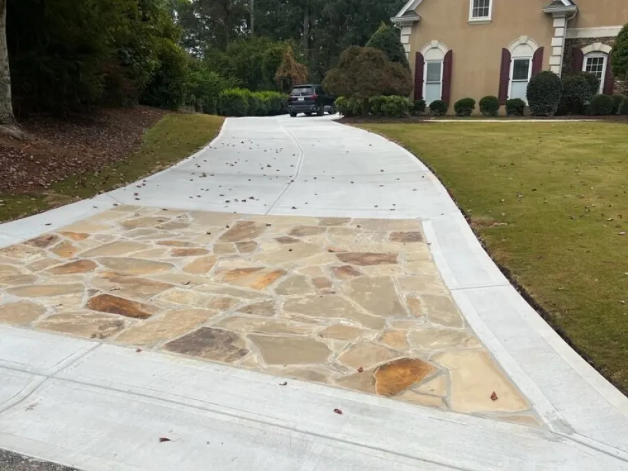 a driveway with a car parked in the driveway