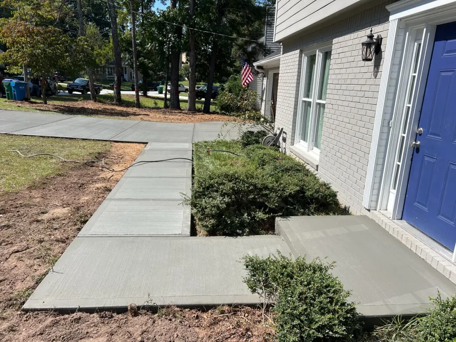 a small driveway next to a house