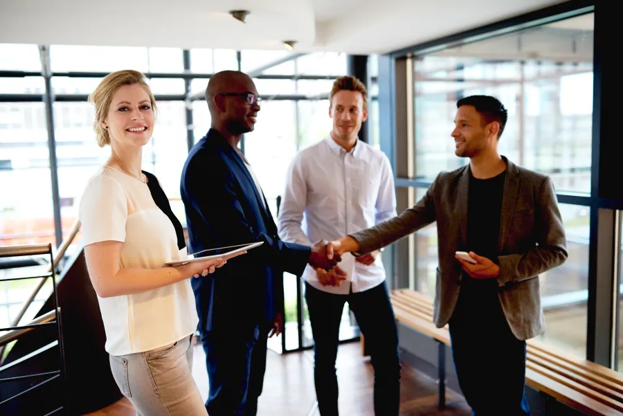 a group of people standing in a room