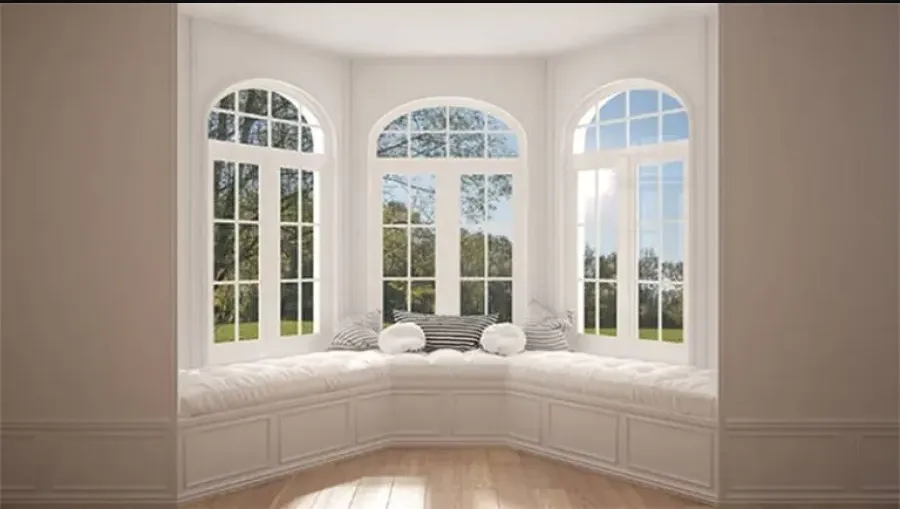 a room with windows and a bed