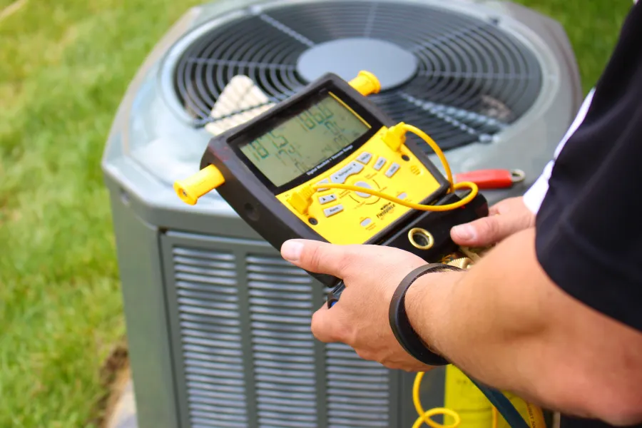 a hvac technician in brookhaven maintaining a unit