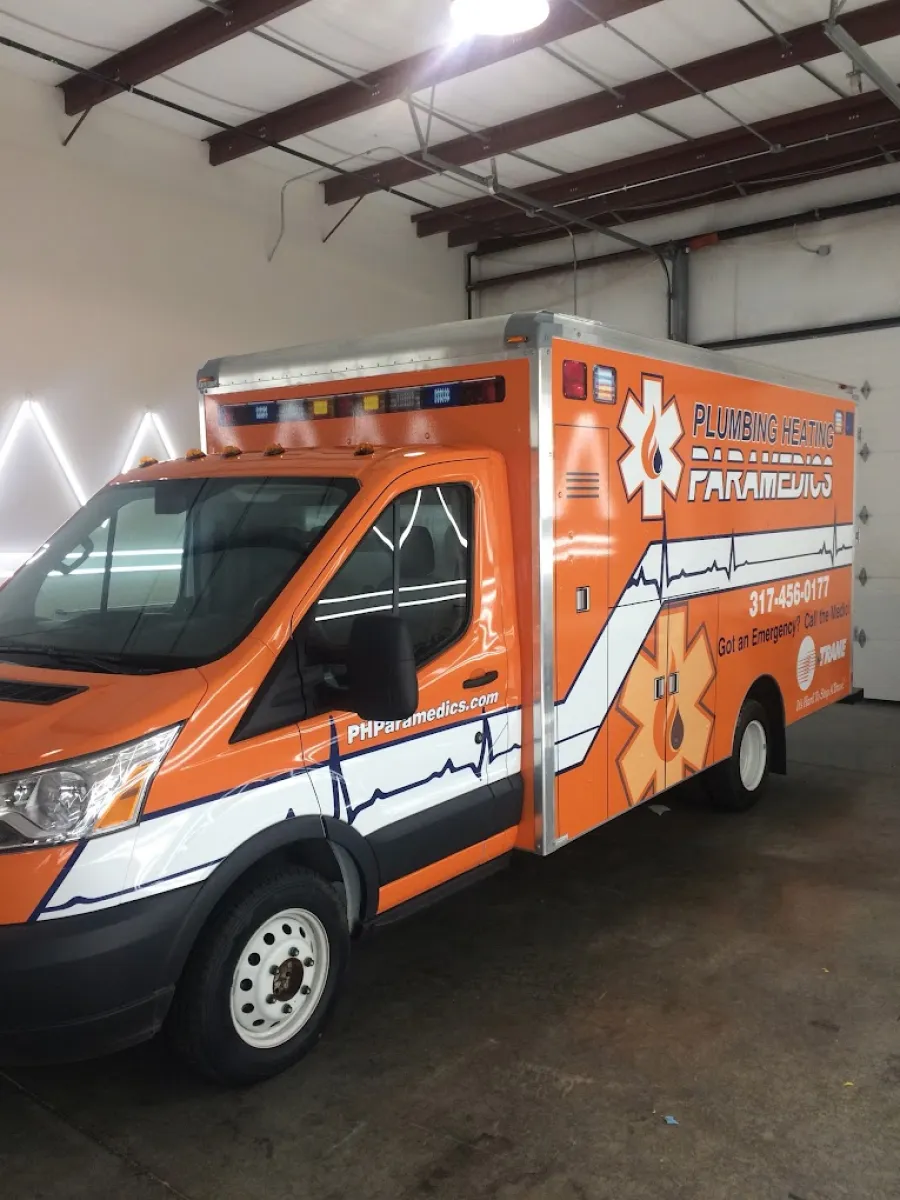 an orange truck in a garage