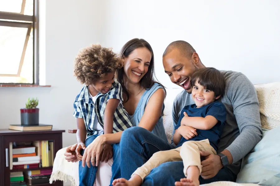 a family sitting on a couch