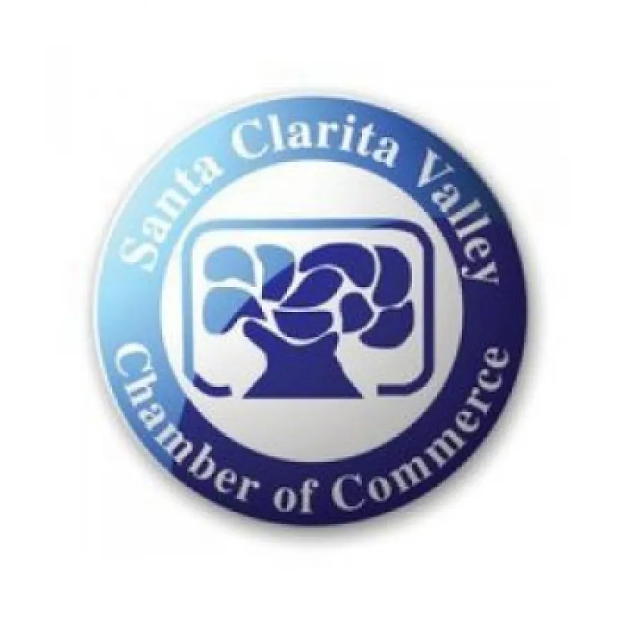 Santa Clarita Valley Chamber of Commerce circular logo with blue tree graphic and white text
