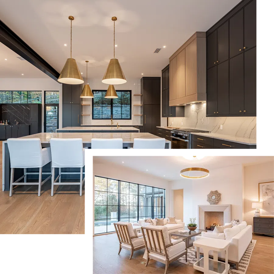 Modern kitchen with black and wood cabinetry, marble countertops, gold pendant lights, and white bar stools on wood floor.