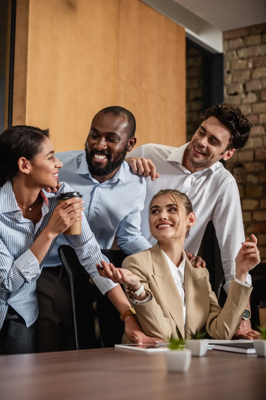 Diverse professionals enjoying a brainstorming session in a modern office environment.