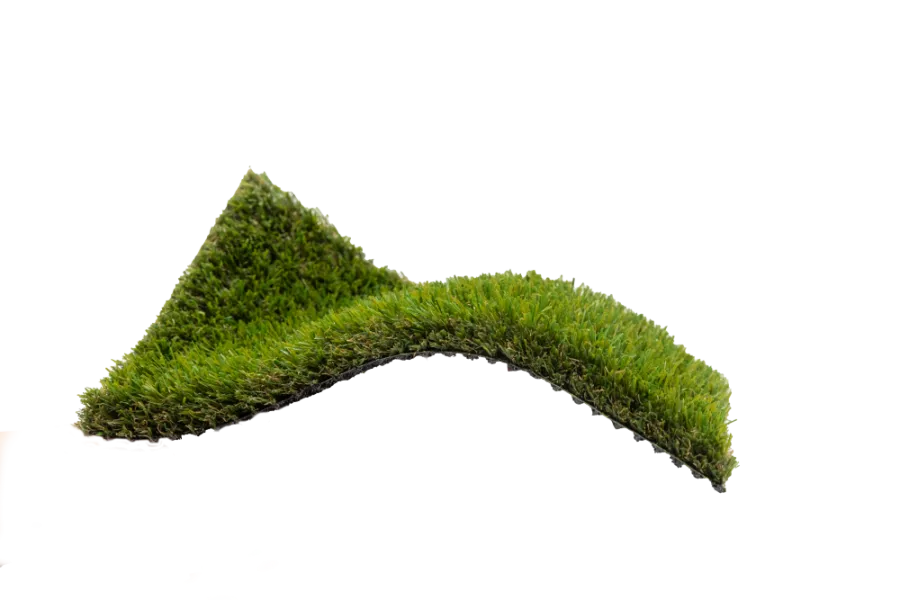 Curved piece of artificial green grass turf isolated on a white background.