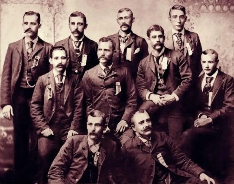a group of men posing for a photo