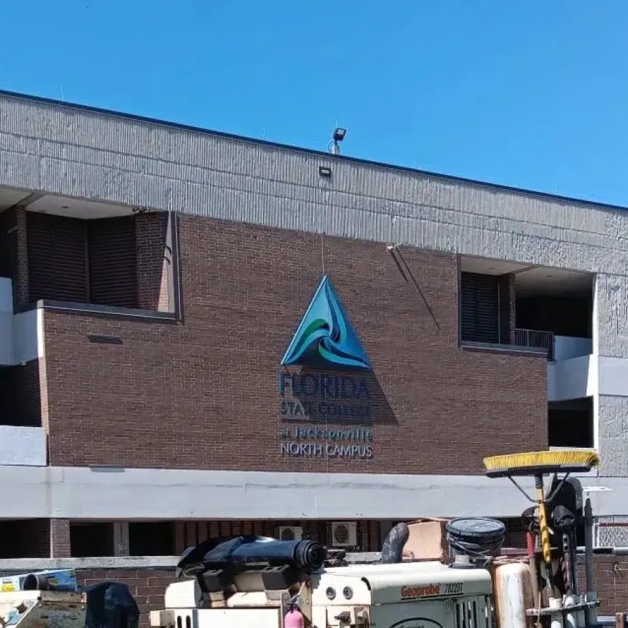 Florida State College North Campus building with construction equipment in foreground under clear blue sky