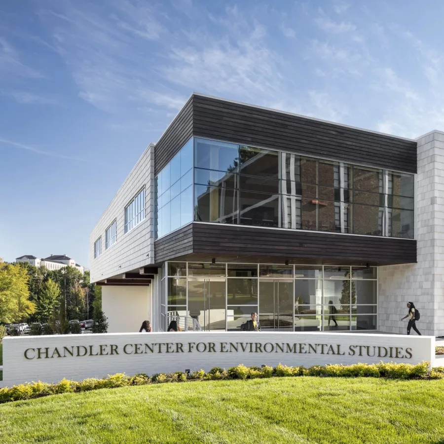 Modern Chandler Center for Environmental Studies building with glass and stone facade on a sunny day.